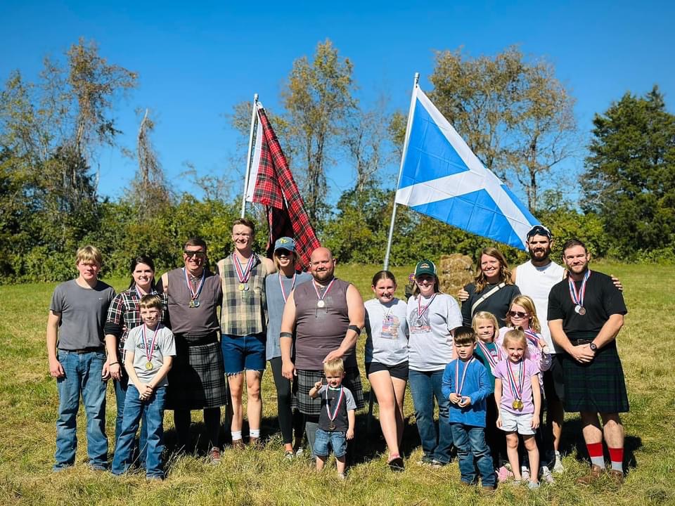 Richmond Kentucky Highland Games group photo with Scottish flags