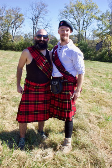 Two Highland Games attendees in kilts